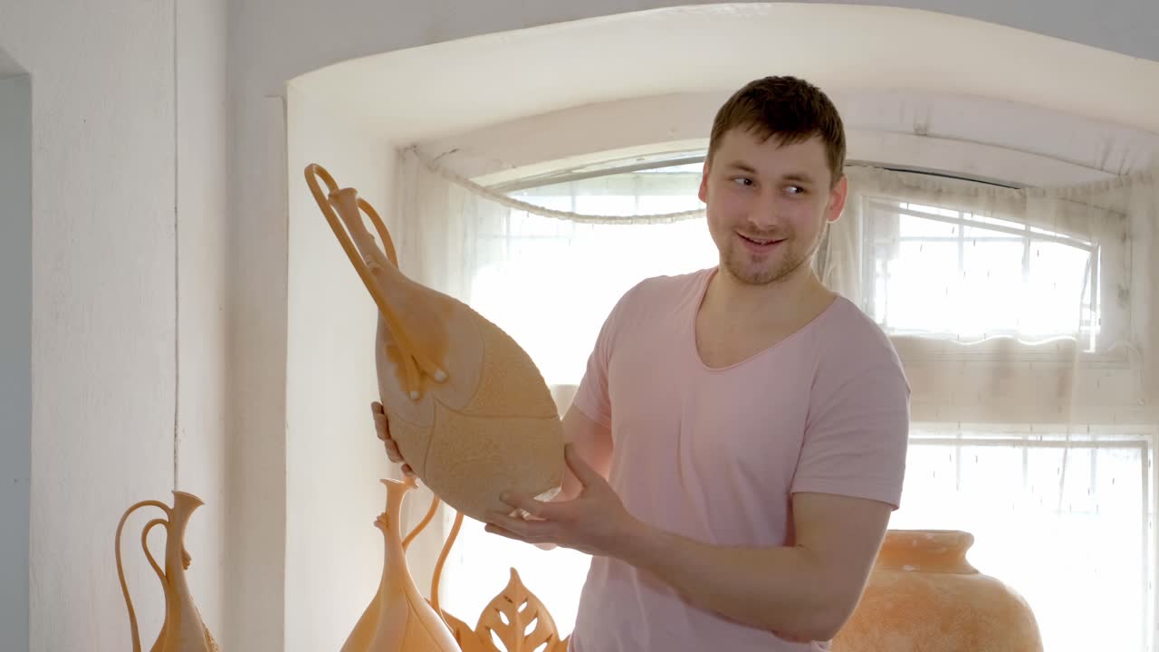 Man Holding a Decorative Ceramic Vase
