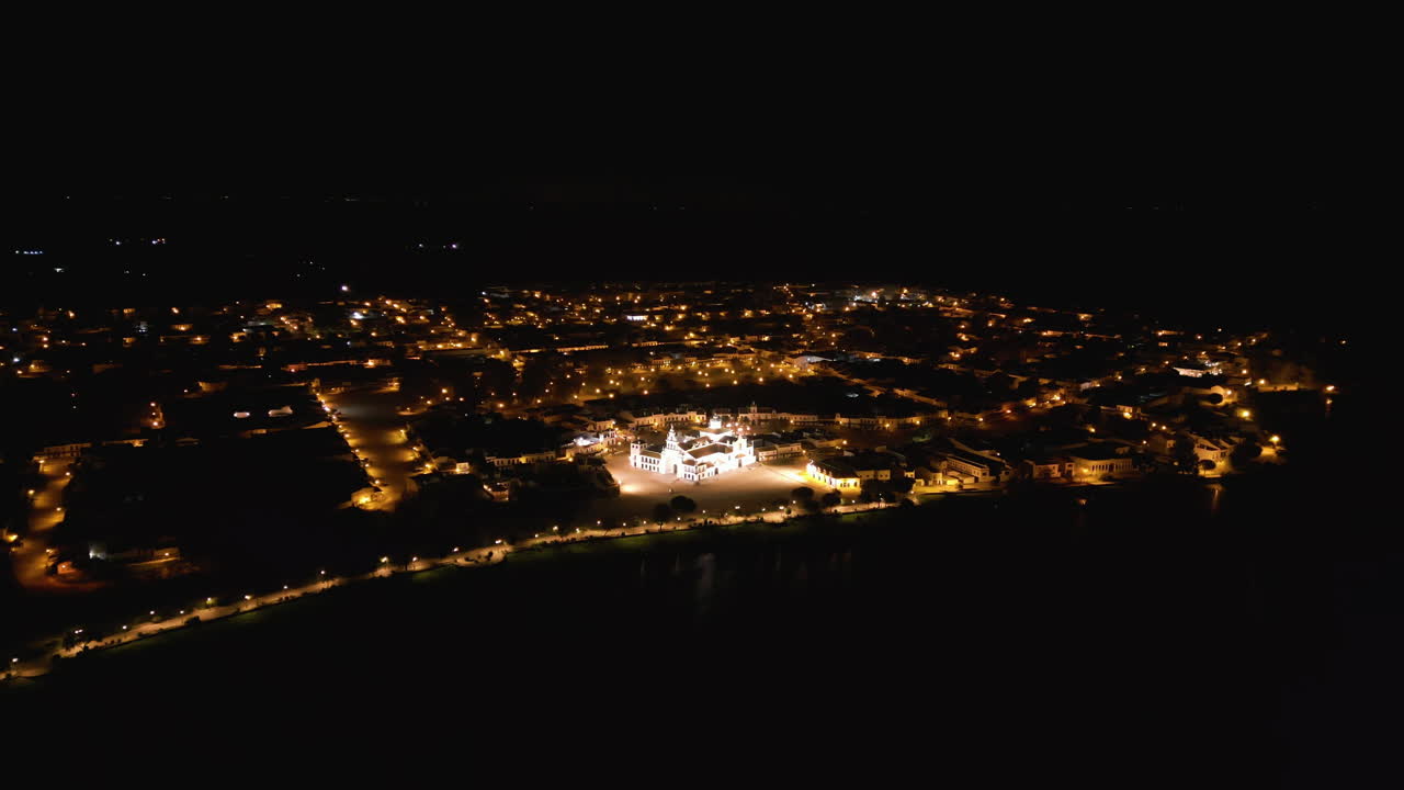 Orbital drone at night, El Rocio catholic church. On the waterfront