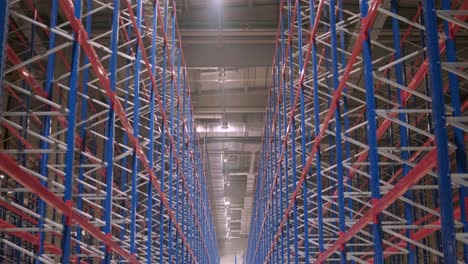 big and modern warehouse under construction, featuring metal shelving and other industrial equipment.