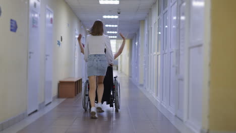 Blonde-woman-runs-pushing-disabled-best-friend-in-wheelchair