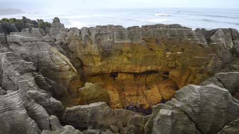 limestone formations the sea in the background