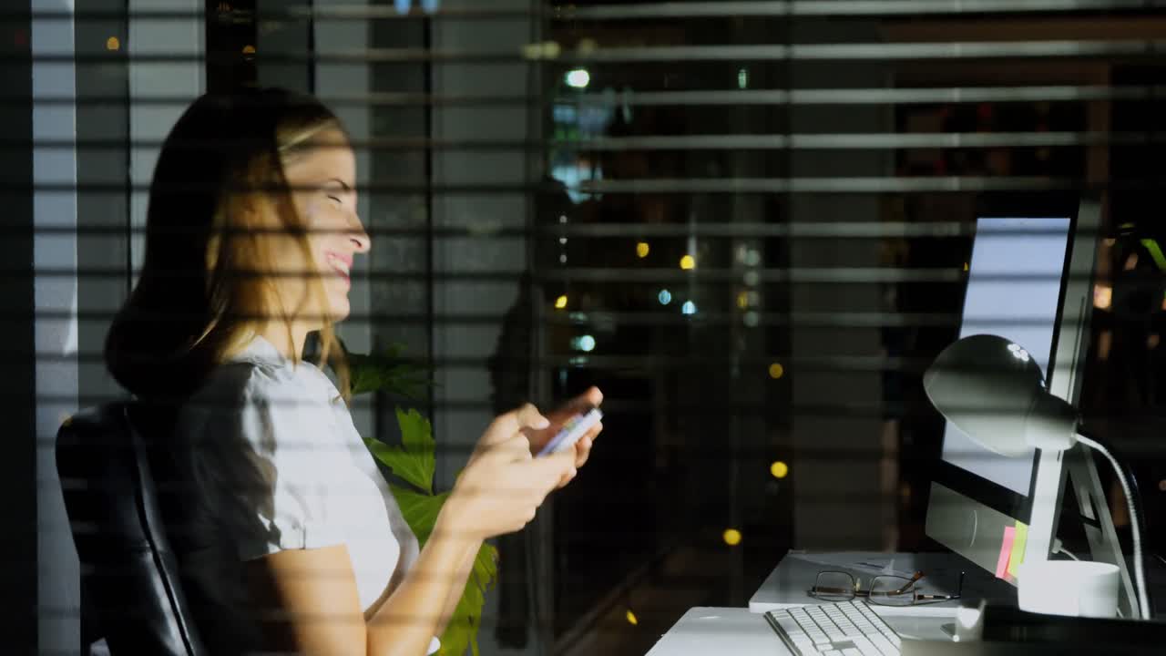 Businesswoman text messaging on mobile phone