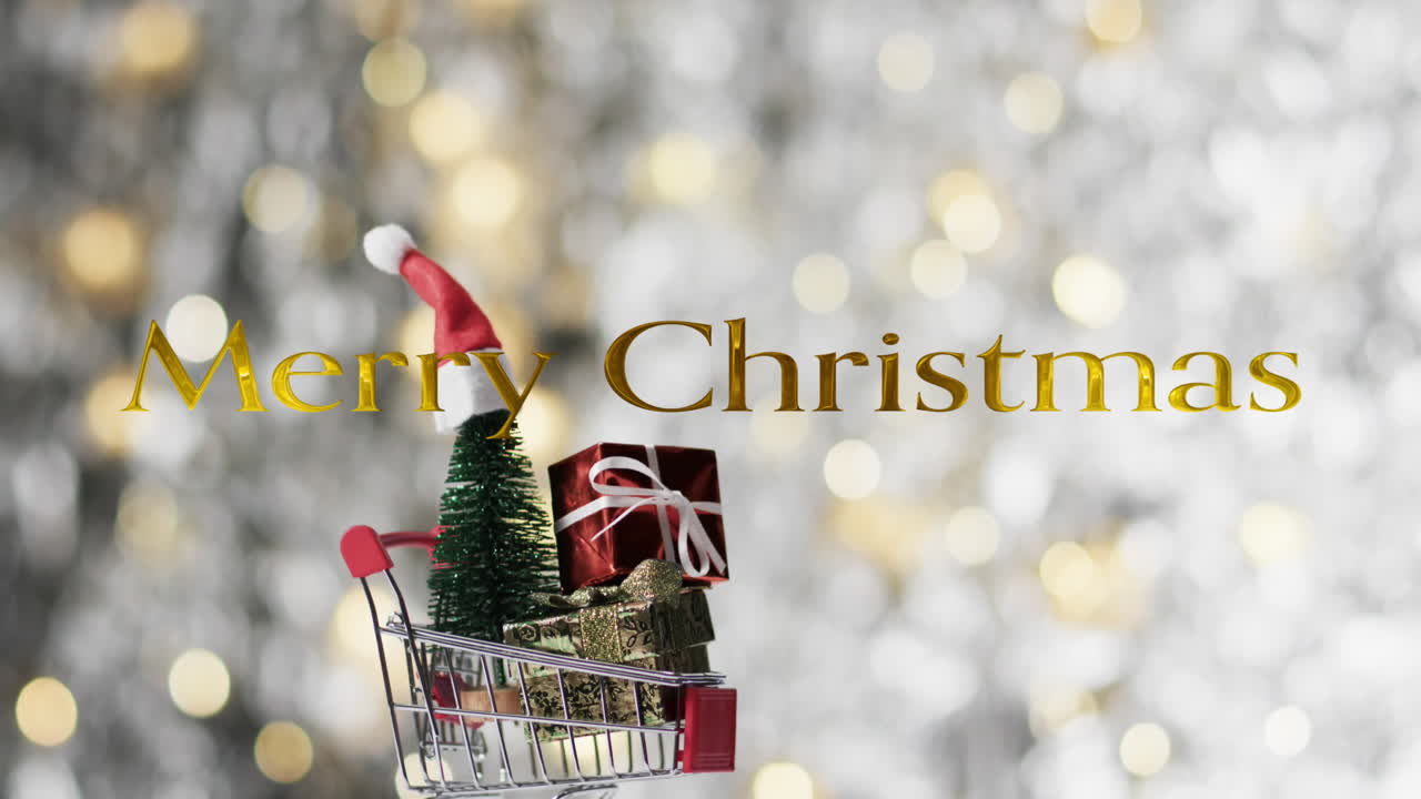 Merry christmas text over christmas hat on tree and gifts in shopping cart on bokeh background