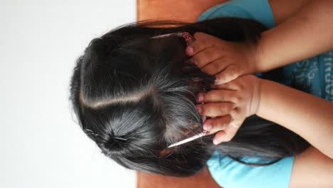 a young girl covering her face