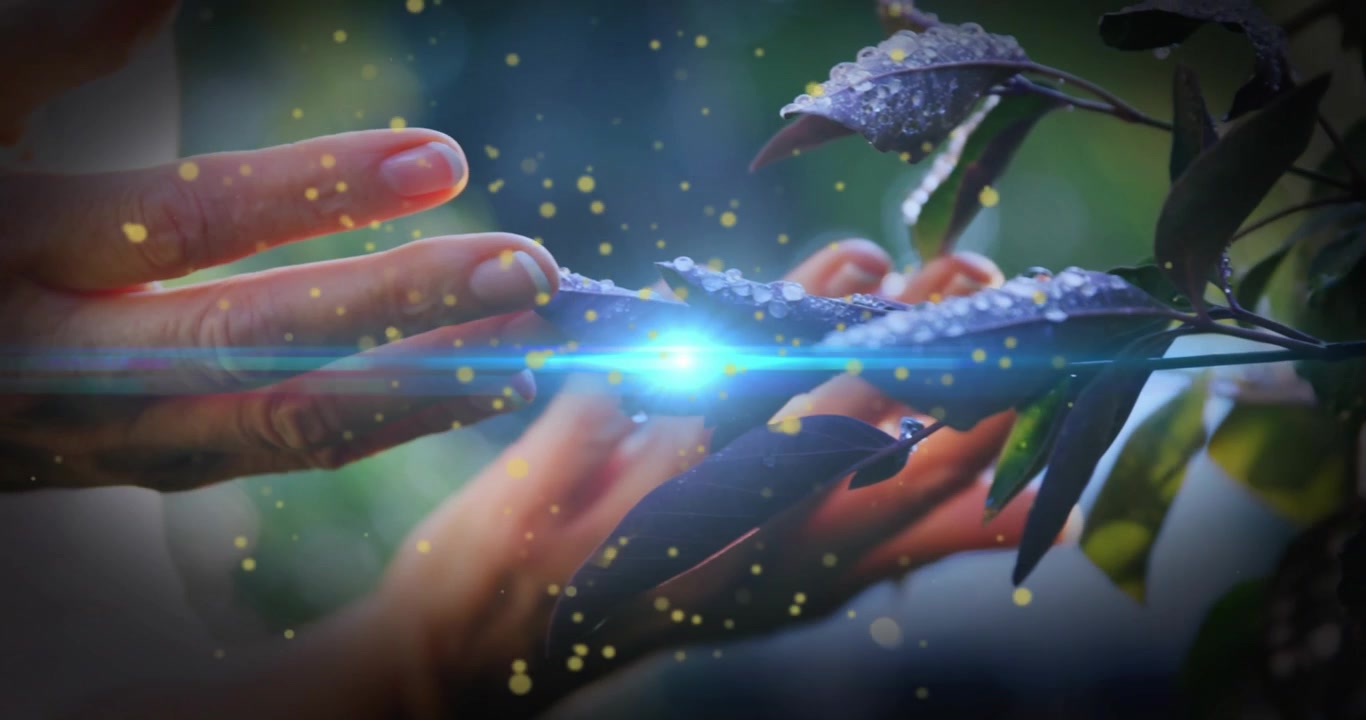 Female hands entering frame and cradling leaf, activating blue spark and lighting droplets for tech