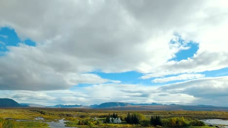 panorama of national icelandic park thingvellir from the highest point in summer day, cloudy sky