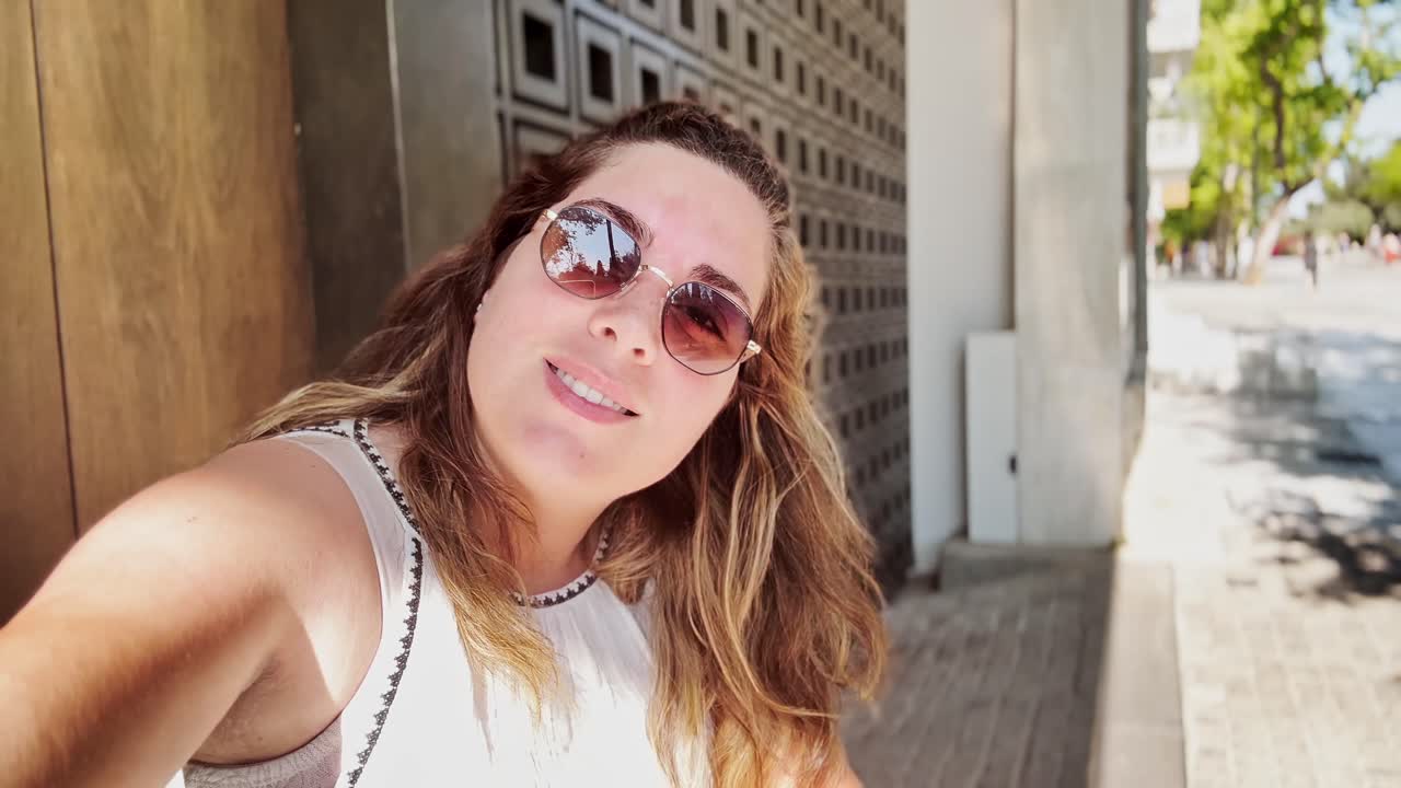 Vlogger Posing with Sunglasses on an Athenian Street
