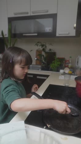 young girl cooking in the kitchen