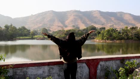 isolated young girl enjoying nature at morning with blurred background