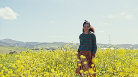 woman, smile and running in field of flowers