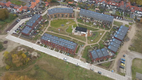 aerial view of small, new neighborhood with solar panels on rooftop