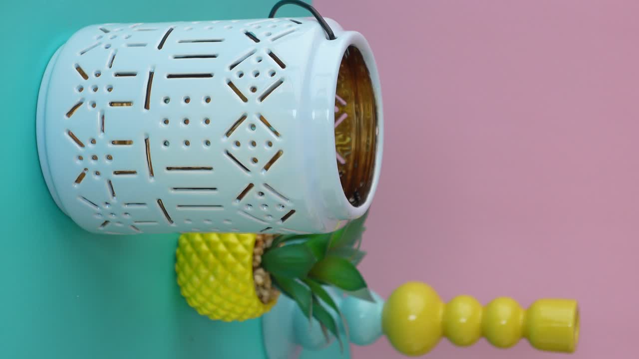 Colorful decorative objects on a two-tone pastel background