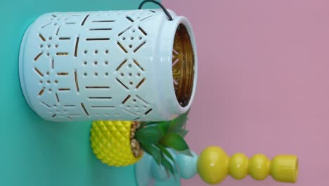 colorful decorative objects on a two-tone pastel background