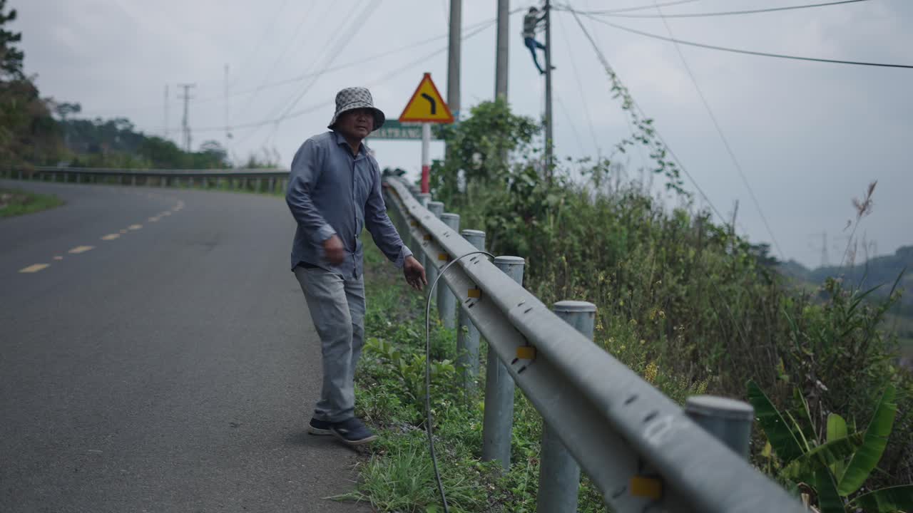 Roadside Worker Repairing Cable