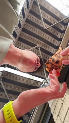 friends enjoying pizza outdoors