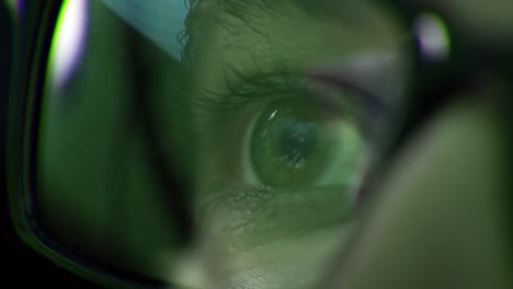 close-up view of an eye through glasses