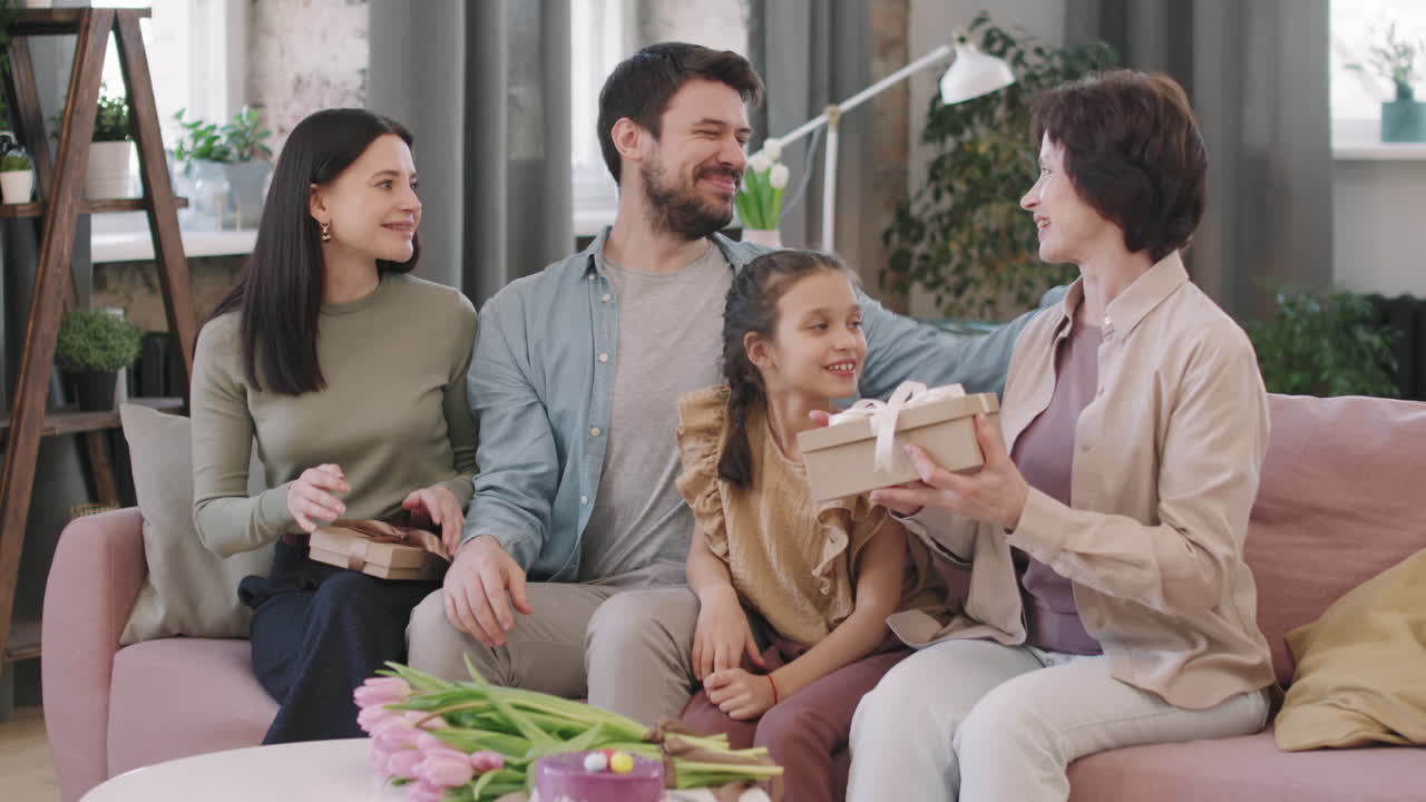 A family gathering with gifts and flowers