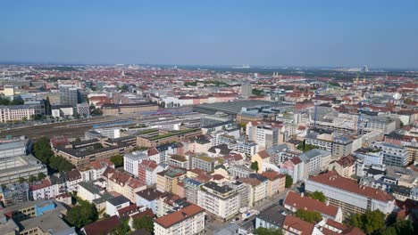 nice aerial top view flight munich main station in city center, german bavarian town at sunny clear sky day 2023