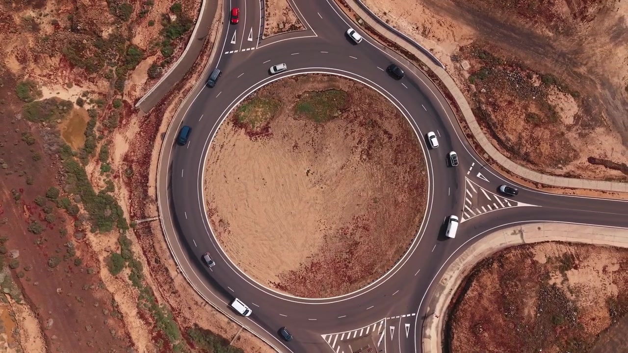 Aerial View of Traffic Flowing Through a Rural Roundabout