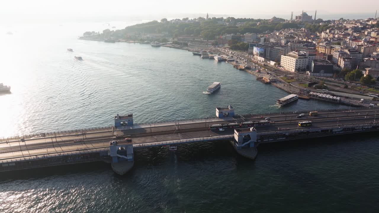 Orbiting Drone Shot Above Galata Bridge in Istanbul along the Golden Horn