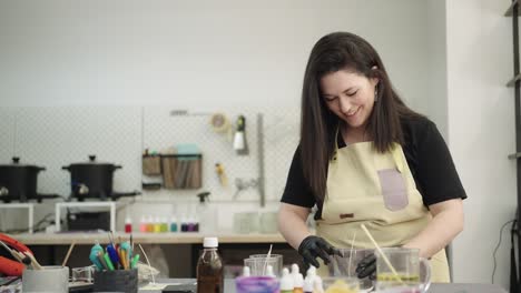woman crafting candles in her workshop