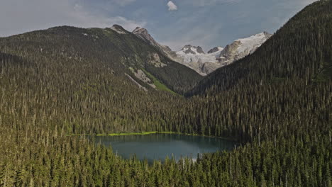 lower joffre lake bc canada aerial v1 flyover forested valley capturing nature beauty of canadian wilderness, pristine lake, mountains and glacier-capped peaks - shot with mavic 3 pro cine - july 2023