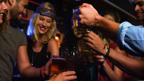 friends toasting beer glasses