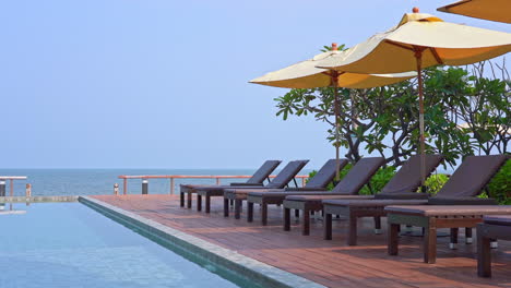 swimming pool by sea in luxury hotel outdoors