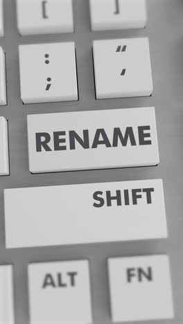 presionar el botón de cambio de nombre en el teclado vídeo vertical