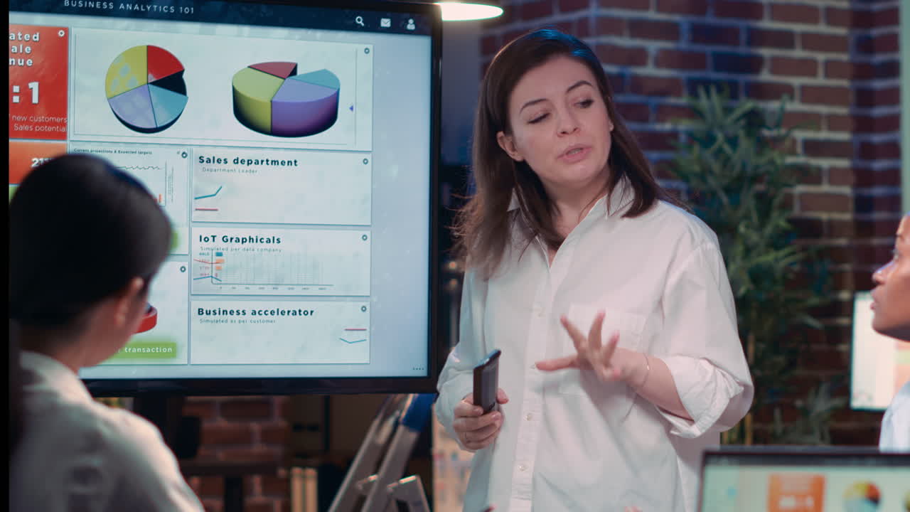 Diverse businesswomen in business meeting, employee presenting analytics research