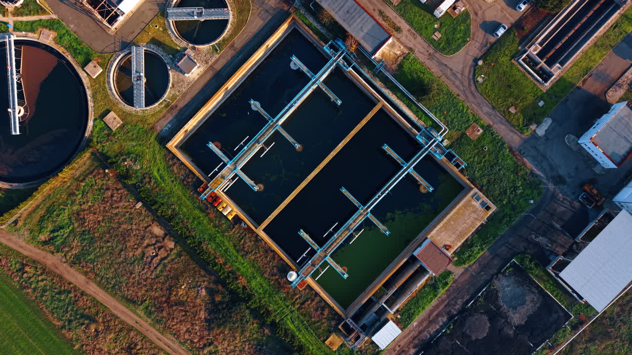 Huge reservoirs of sewage waters. Birds fly over the territory of modern waste water treatment plant. Top view