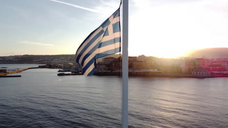 national flag in harbor with sunset