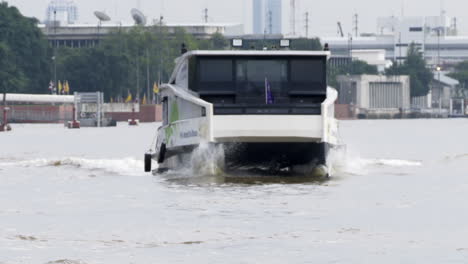modern electric catamaran ferry on a city river