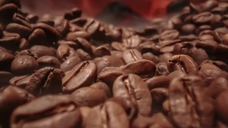 close up of seeds of coffee. fragrant coffee beans are roasted smoke comes from coffee beans.