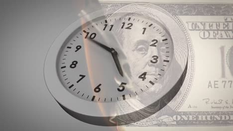 Animation-of-clock-ticking-over-american-dollar-bill-burning