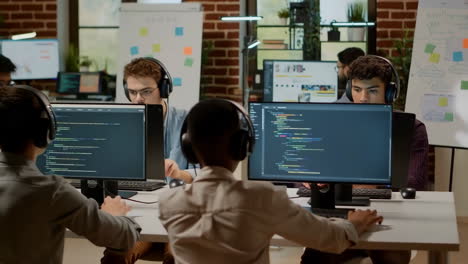 young developers coding and collaborating in a modern tech office