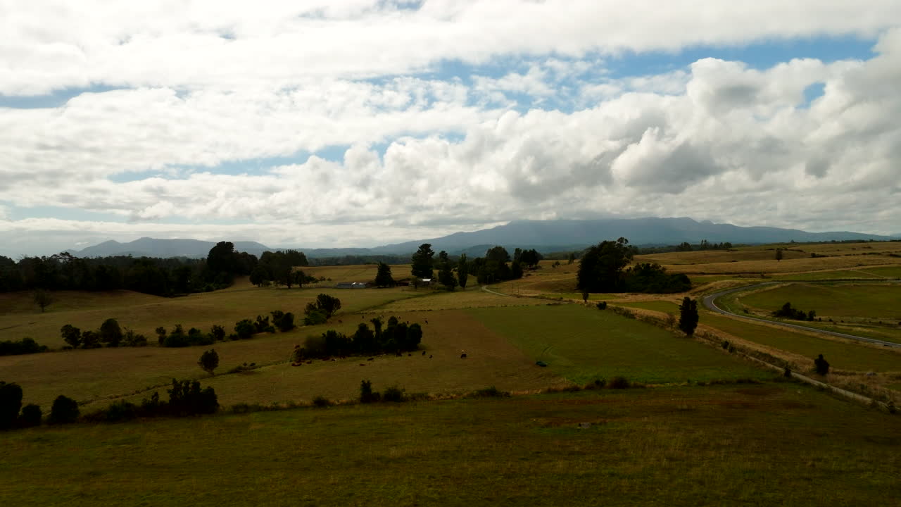 Scenic Landscape With Fields And Cloudy Blue Sky In Puerto Varas, Chile - Aerial Shot
