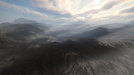 aerial view of majestic mountains with sunlight breaking through clouds