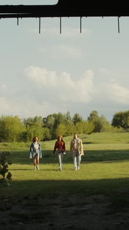 friends walking in a field