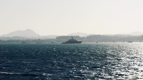 view of ships, ferries, and sailboats sailing on the waters of the ionian sea near corfu island