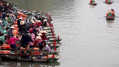 tourists boarding boats for a river tour