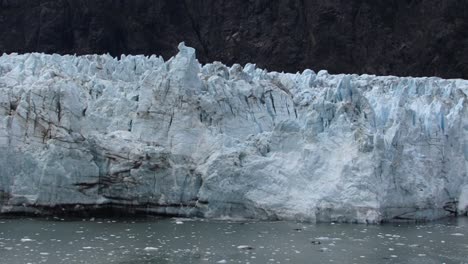 small chunks of ice falling from margerie glacier, alaska