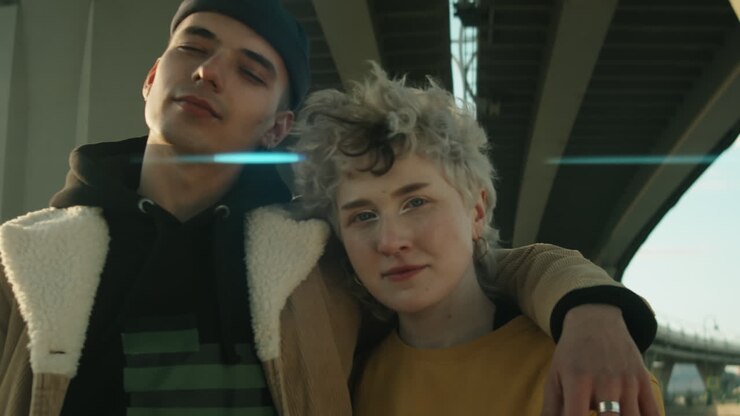 Portrait of Young Couple in Streetwear Outdoors in City