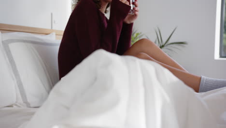relaxing in bed, woman drinking tea and enjoying peaceful morning moment