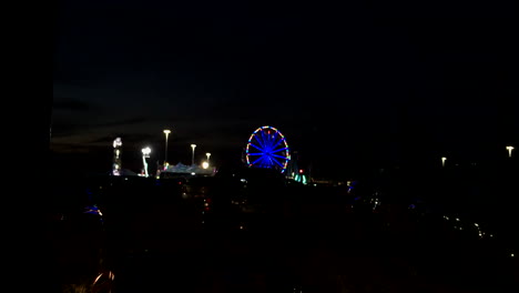 ferris wheel in a carnival at night.