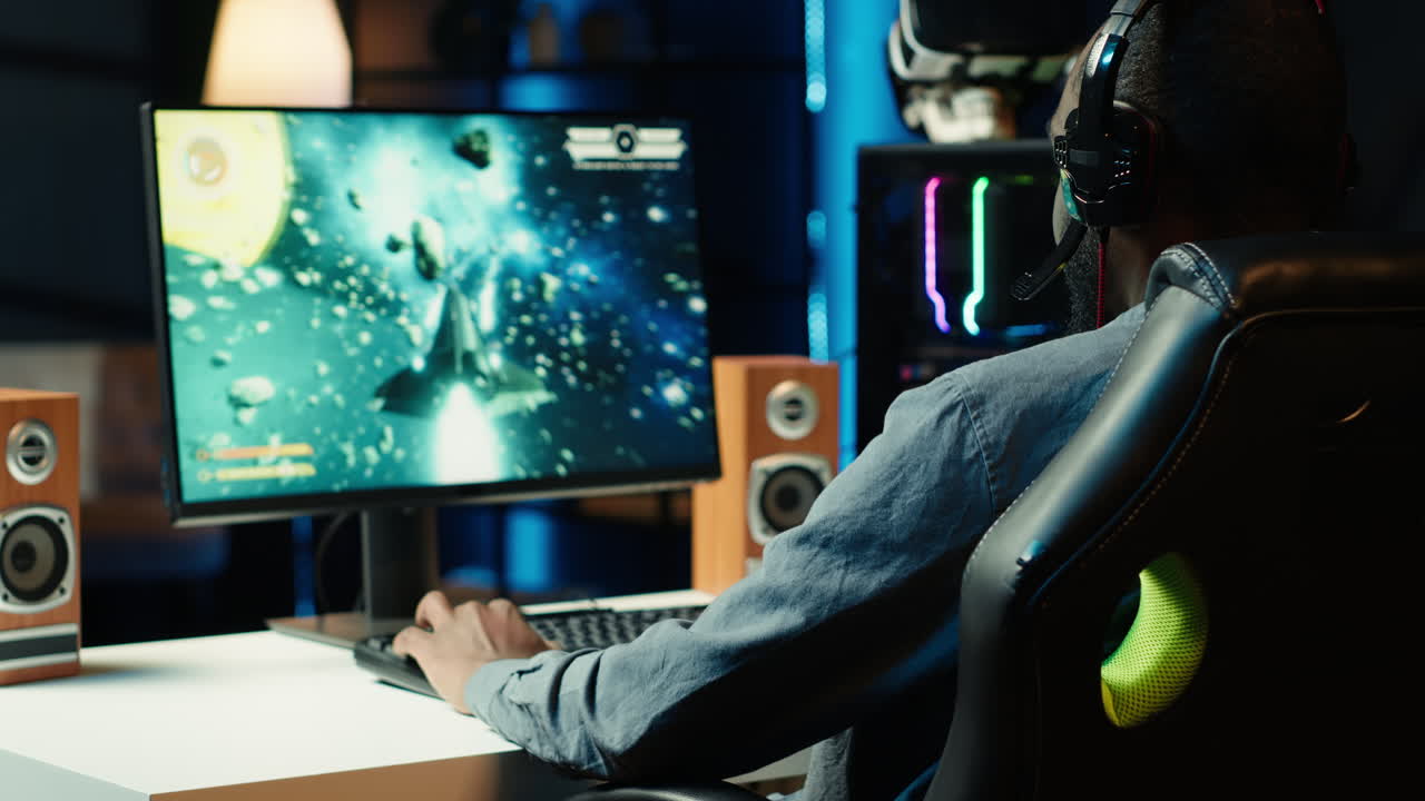 Man having fun playing videogames on desktop computer