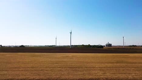 Aerial-Approaching-Shot-of-Windmill-Farm-in-USA-Countryside