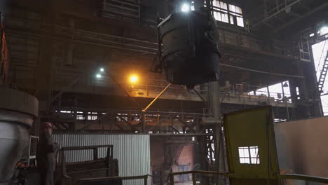 metal foundry interior with worker