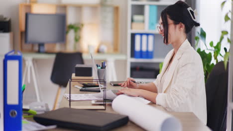 woman working in office on laptop