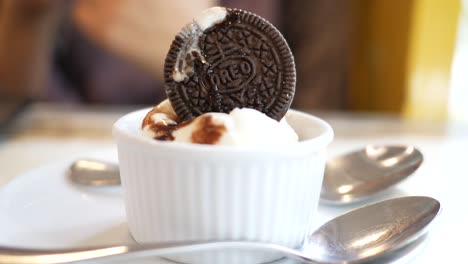 oreo cookie on top of vanilla ice cream